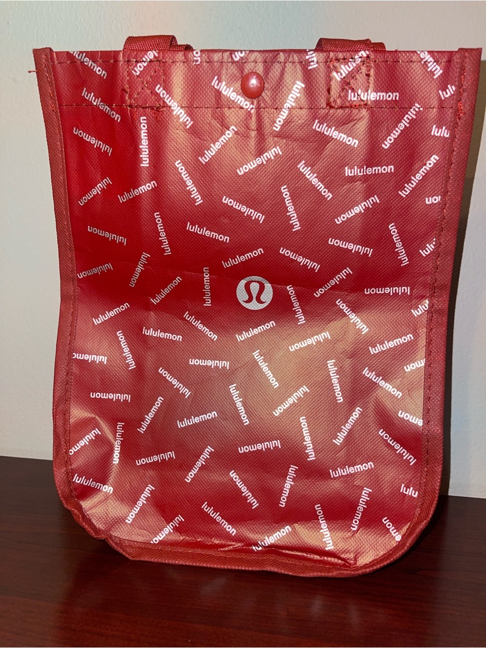 lululemon red reusable tote bag with white logo text